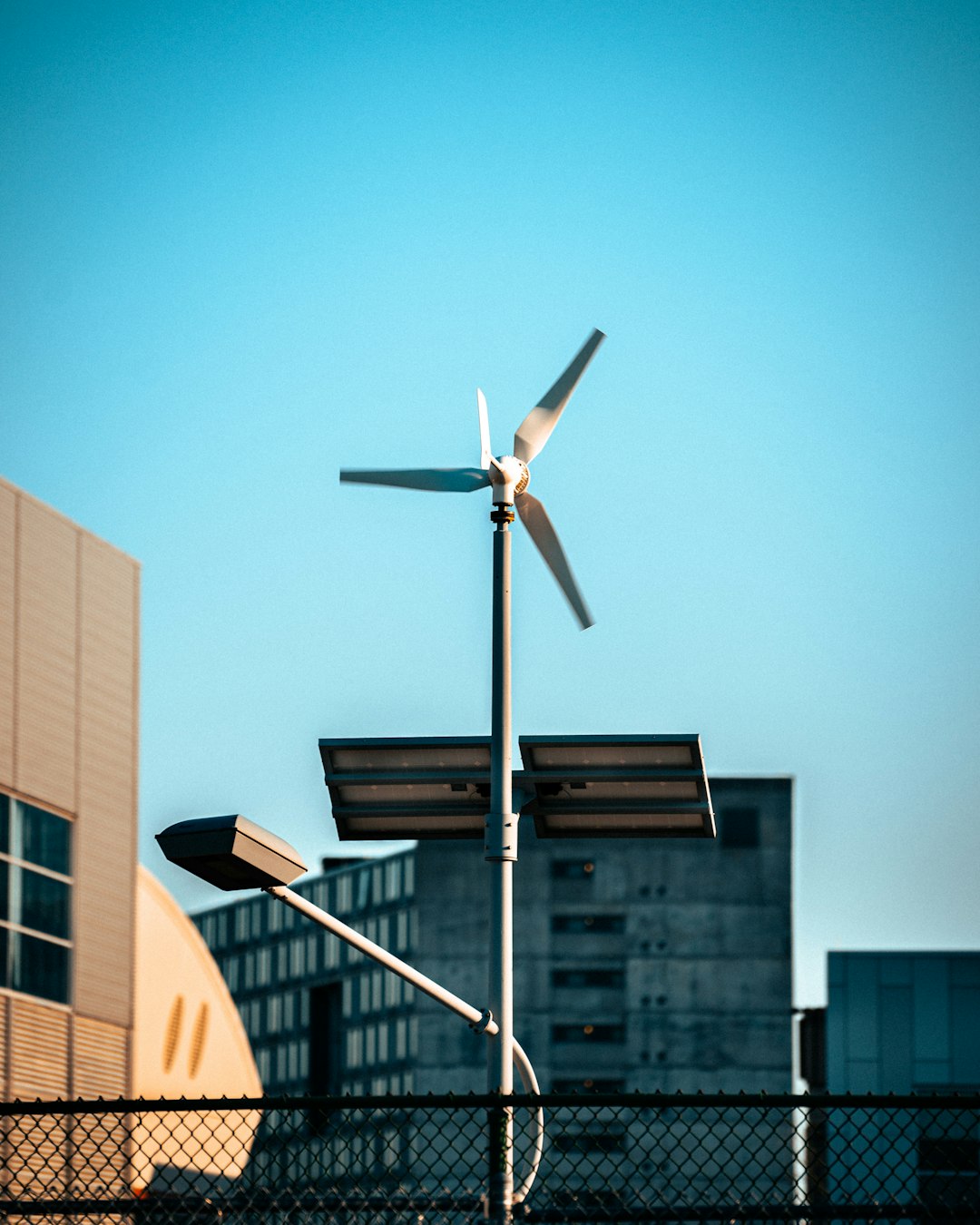 a-wind-turbine-on-top-of-a-metal-pole-xxmt1vpfr48