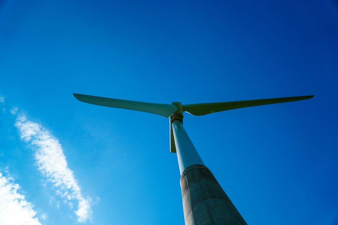 white-wind-turbine-under-blue-sky-during-daytime-yukdzet48wy